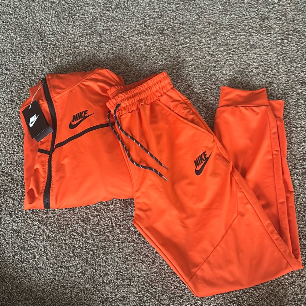 Orange nike tech suit